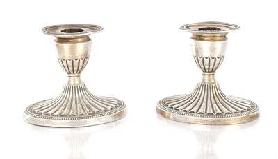 Lot 251 - A PAIR OF EDWARD VII SILVER CANDLESTICKS