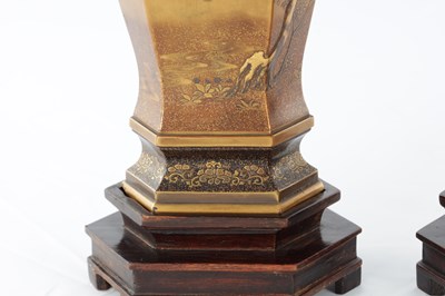 Lot A FINE PAIR OF JAPANESE MEIJI PERIOD GOLD LACQUERWORK CABINET VASES ON HARDWOOD STANDS