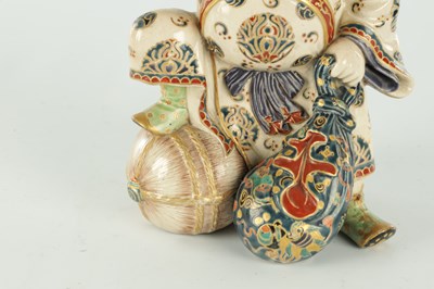 Lot 673 - A JAPANESE MEIJI PERIOD SATSUMA FIGURE OF THE LUCKY GOD DAIKOKU