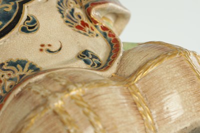 Lot 673 - A JAPANESE MEIJI PERIOD SATSUMA FIGURE OF THE LUCKY GOD DAIKOKU