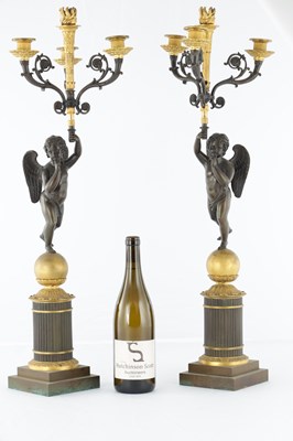 Lot 932 - A PAIR OF 19TH CENTURY FRENCH BRONZE AND GILT BRONZE FOUR BRANCH FIGURAL CANDELABRA