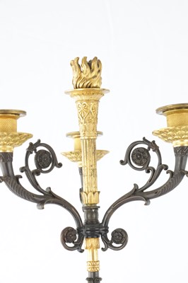 Lot 932 - A PAIR OF 19TH CENTURY FRENCH BRONZE AND GILT BRONZE FOUR BRANCH FIGURAL CANDELABRA