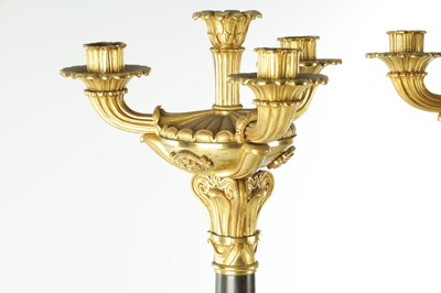 Lot 911 - A PAIR OF 19TH CENTURY REGENCY STYLE BRONZE AND GILT BRONZE THREE BRANCH CANDELARBRA