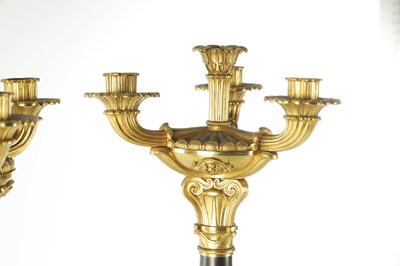 Lot 911 - A PAIR OF 19TH CENTURY REGENCY STYLE BRONZE AND GILT BRONZE THREE BRANCH CANDELARBRA