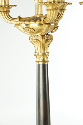 Lot 911 - A PAIR OF 19TH CENTURY REGENCY STYLE BRONZE AND GILT BRONZE THREE BRANCH CANDELARBRA