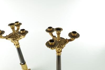 Lot 911 - A PAIR OF 19TH CENTURY REGENCY STYLE BRONZE AND GILT BRONZE THREE BRANCH CANDELARBRA