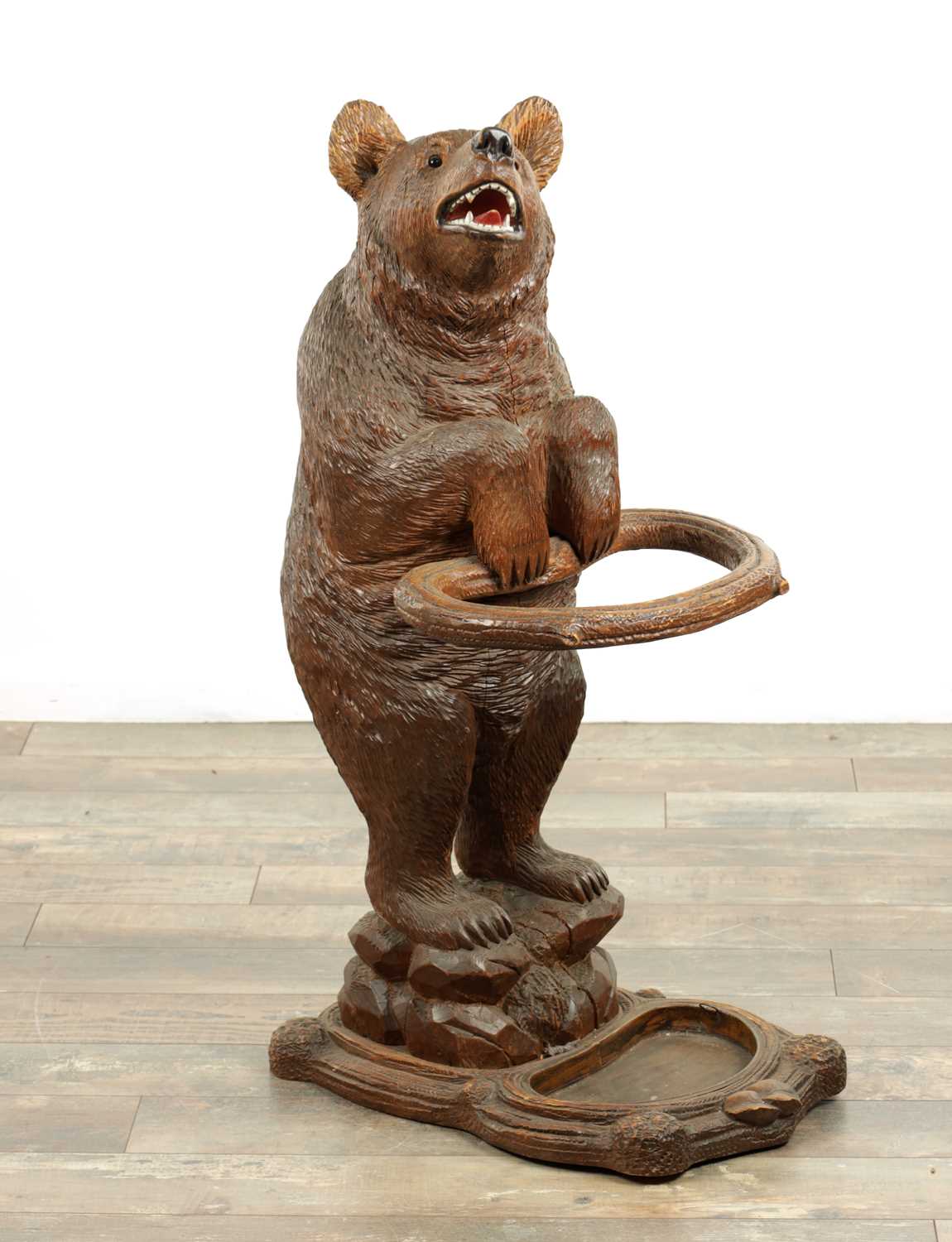 Lot 951 - A LATE 19TH CENTURY CARVED BLACK FOREST BEAR STICK STAND