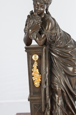 Lot A LATE 19TH CENTURY FRENCH BRONZE, ORMOLU AND ROUGE MARBLE CLOCK GARNITURE