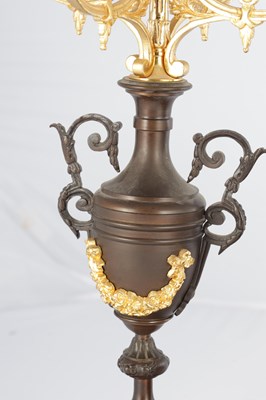Lot A LATE 19TH CENTURY FRENCH BRONZE, ORMOLU AND ROUGE MARBLE CLOCK GARNITURE