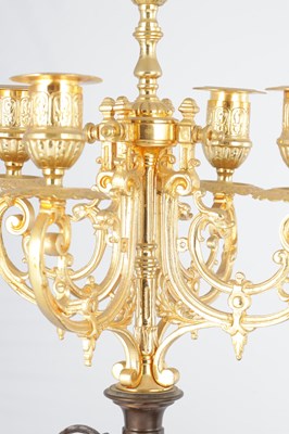 Lot A LATE 19TH CENTURY FRENCH BRONZE, ORMOLU AND ROUGE MARBLE CLOCK GARNITURE