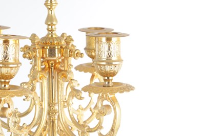 Lot A LATE 19TH CENTURY FRENCH BRONZE, ORMOLU AND ROUGE MARBLE CLOCK GARNITURE