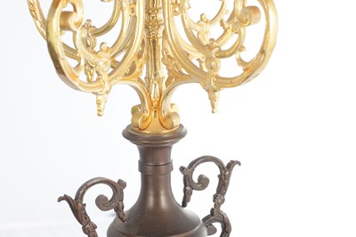 Lot A LATE 19TH CENTURY FRENCH BRONZE, ORMOLU AND ROUGE MARBLE CLOCK GARNITURE