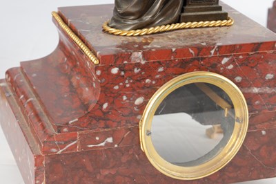 Lot A LATE 19TH CENTURY FRENCH BRONZE, ORMOLU AND ROUGE MARBLE CLOCK GARNITURE