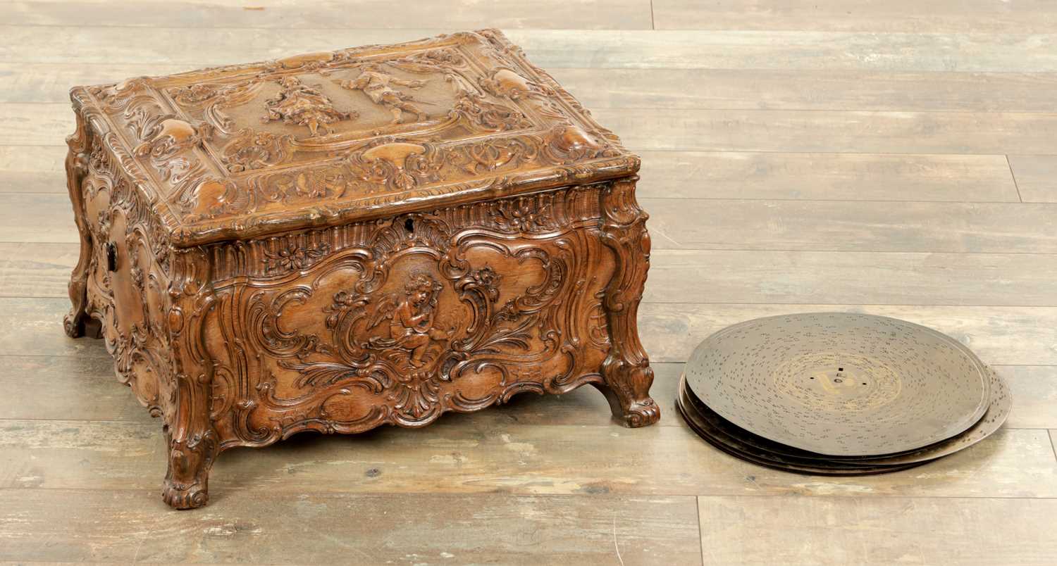 Lot 1042 - A LATE 19TH CENTURY GERMAN CARVED OAK SYMPHONION MUSIC BOX