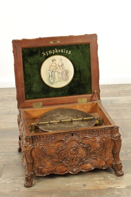 Lot 1042 - A LATE 19TH CENTURY GERMAN CARVED OAK SYMPHONION MUSIC BOX