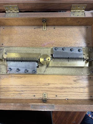 Lot 1042 - A LATE 19TH CENTURY GERMAN CARVED OAK SYMPHONION MUSIC BOX