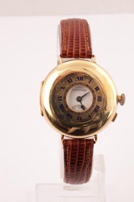 Lot 1303 - IWC SCHAFFHAUSEN AN EARLY 20TH CENTURY HALF HUNTER 18CT GOLD WRIST WATCH