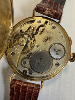 Lot 1303 - IWC SCHAFFHAUSEN AN EARLY 20TH CENTURY HALF HUNTER 18CT GOLD WRIST WATCH