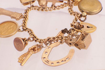 Lot 106 - A 9CT GOLD CHARM BRACELET WITH SOVEREIGN