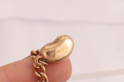 Lot 106 - A 9CT GOLD CHARM BRACELET WITH SOVEREIGN