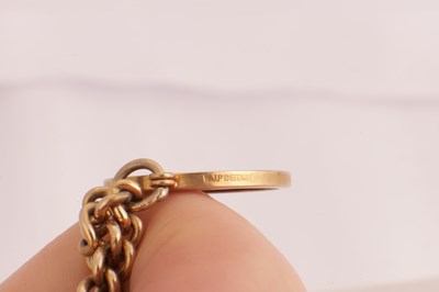 Lot 106 - A 9CT GOLD CHARM BRACELET WITH SOVEREIGN
