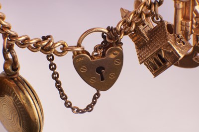 Lot 106 - A 9CT GOLD CHARM BRACELET WITH SOVEREIGN