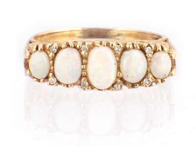 Lot 131 - A LADIES YELLOW GOLD OPAL FIVE STONE RING