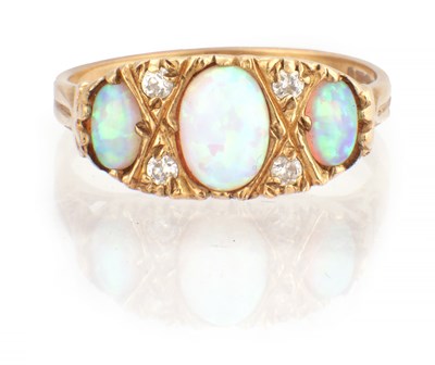 Lot 170 - A LADIES 9CT YELLOW GOLD, DIAMOND AND OPAL RING