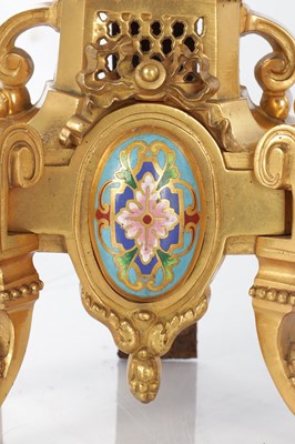 Lot A PAIR OF LATE 19TH CENTURY FRENCH ORMOLU AND CHAMPLEVE ENAMELLED FIRE DOGS