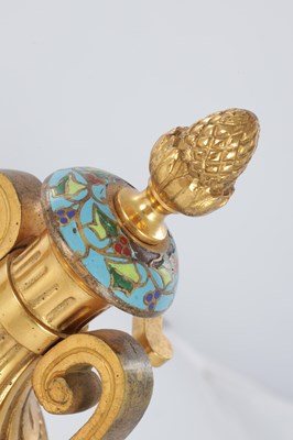 Lot A PAIR OF LATE 19TH CENTURY FRENCH ORMOLU AND CHAMPLEVE ENAMELLED FIRE DOGS