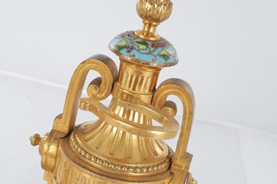 Lot A PAIR OF LATE 19TH CENTURY FRENCH ORMOLU AND CHAMPLEVE ENAMELLED FIRE DOGS