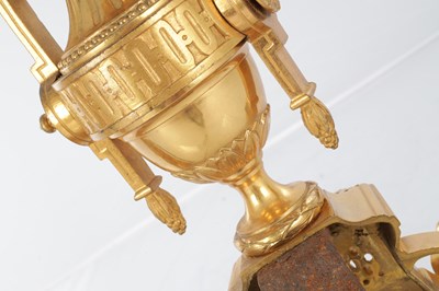 Lot A PAIR OF LATE 19TH CENTURY FRENCH ORMOLU AND CHAMPLEVE ENAMELLED FIRE DOGS