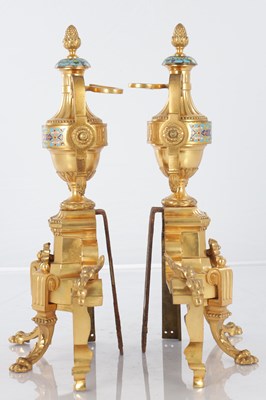 Lot A PAIR OF LATE 19TH CENTURY FRENCH ORMOLU AND CHAMPLEVE ENAMELLED FIRE DOGS