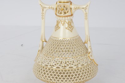 Lot 80 - GEORGE OWEN A FINE ROYAL WORCESTER JEWELLED GILT AND IVORY GROUND TWO-HANDLED FOOTED CABINET VASE