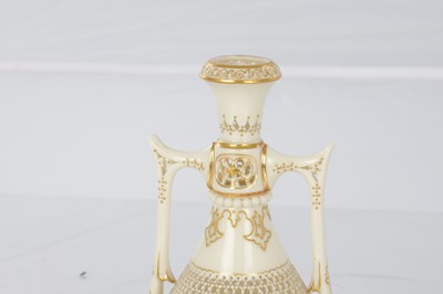 Lot 80 - GEORGE OWEN A FINE ROYAL WORCESTER JEWELLED GILT AND IVORY GROUND TWO-HANDLED FOOTED CABINET VASE