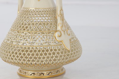 Lot 80 - GEORGE OWEN A FINE ROYAL WORCESTER JEWELLED GILT AND IVORY GROUND TWO-HANDLED FOOTED CABINET VASE