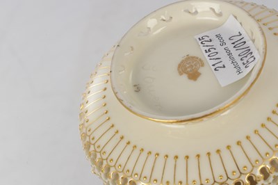 Lot 80 - GEORGE OWEN A FINE ROYAL WORCESTER JEWELLED GILT AND IVORY GROUND TWO-HANDLED FOOTED CABINET VASE