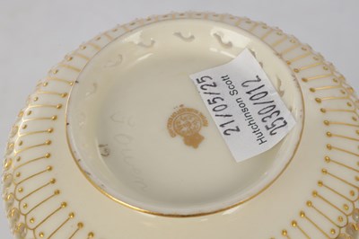 Lot 80 - GEORGE OWEN A FINE ROYAL WORCESTER JEWELLED GILT AND IVORY GROUND TWO-HANDLED FOOTED CABINET VASE