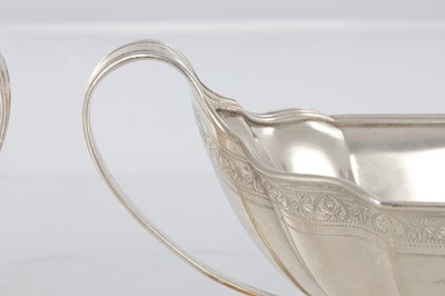 Lot 248 - A GOOD PAIR OF GEORGE III SILVER TWO HANDLED SAUCE BOATS