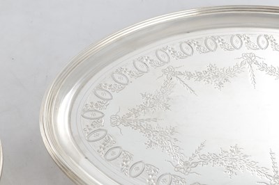 Lot 285 - A GOOD PAIR OF GEORGE III HEPPLEWHITE STYLE OVAL SILVER TRAYS