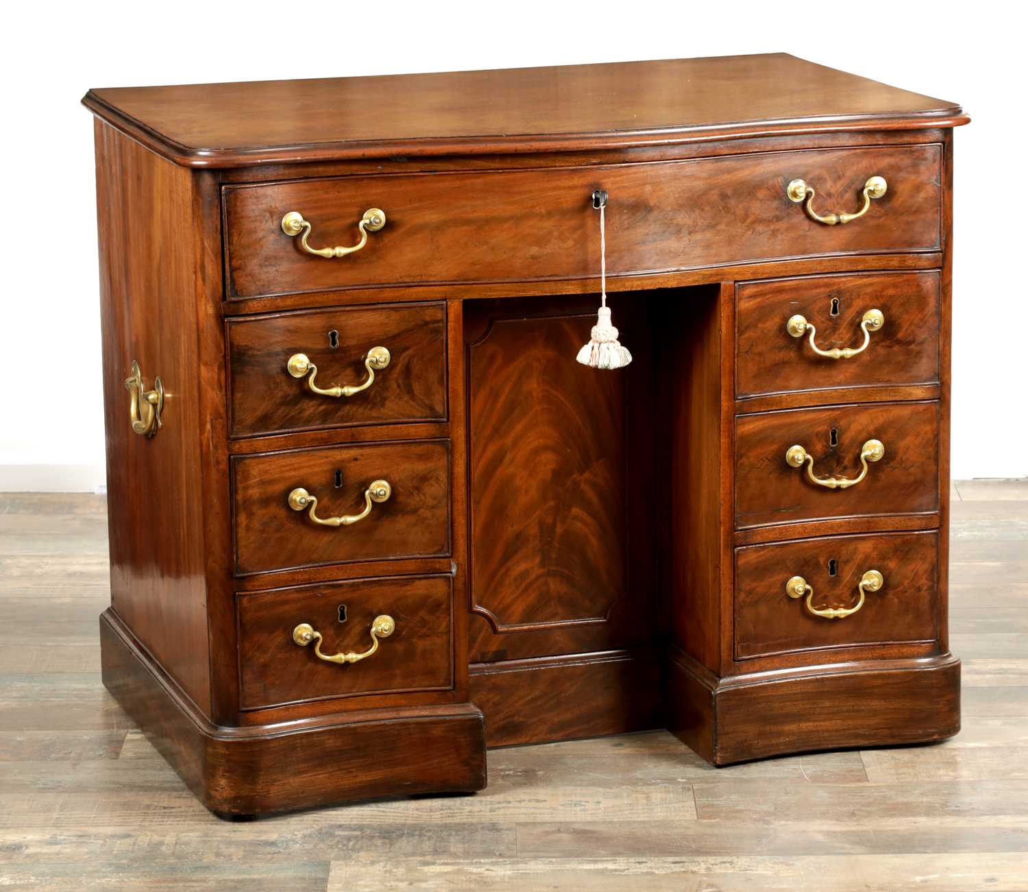 Lot 1719 - A FINE MID 18TH CENTURY MAHOGANY SERPENTINE SHAPED KNEEHOLE DESK IN THE MANNER OF THOMAS CHIPPENDALE