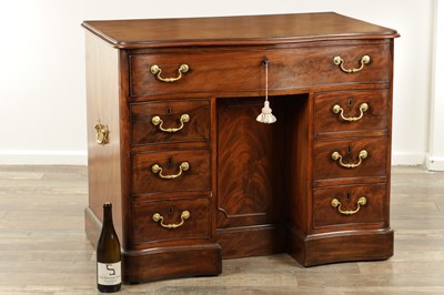Lot 1719 - A FINE MID 18TH CENTURY MAHOGANY SERPENTINE SHAPED KNEEHOLE DESK IN THE MANNER OF THOMAS CHIPPENDALE