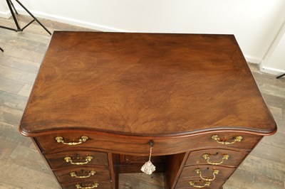 Lot 1719 - A FINE MID 18TH CENTURY MAHOGANY SERPENTINE SHAPED KNEEHOLE DESK IN THE MANNER OF THOMAS CHIPPENDALE
