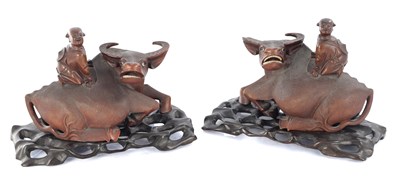 Lot 415 - A PAIR OF 19TH CENTURY CHINESE CARVED HARDWOOD SCULPTURES OF WATER BUFFALO