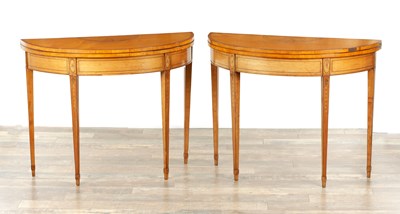 Lot 1715 - A PAIR OF GEORGE III INLAID SATINWOOD DEMI LUNE CARD TABLES IN THE MANNER OF MOORE OF DUBLIN