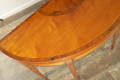 Lot 1715 - A PAIR OF GEORGE III INLAID SATINWOOD DEMI LUNE CARD TABLES IN THE MANNER OF MOORE OF DUBLIN