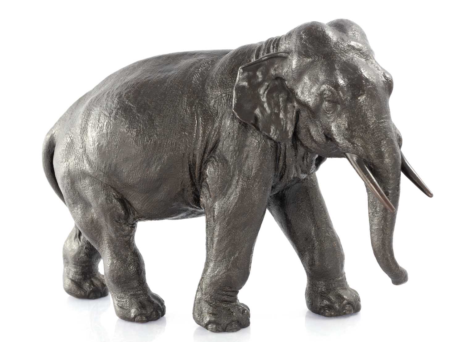 Lot 366 - A JAPANESE MEIJI PERIOD PATINATED BRONZE SCULPTURE OF AN ELEPHANT