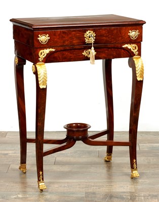Lot 1687 - A 19TH CENTURY FRENCH EMPIRE FIGURED MAHOGANY AND ORMOLU MOUNTED WORK TABLE