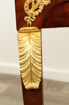 Lot 1687 - A 19TH CENTURY FRENCH EMPIRE FIGURED MAHOGANY AND ORMOLU MOUNTED WORK TABLE