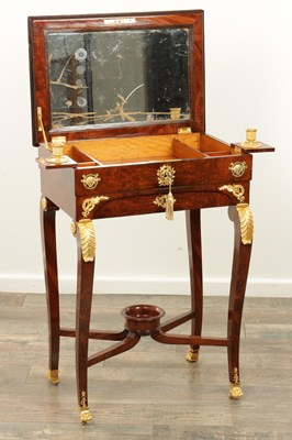 Lot 1687 - A 19TH CENTURY FRENCH EMPIRE FIGURED MAHOGANY AND ORMOLU MOUNTED WORK TABLE